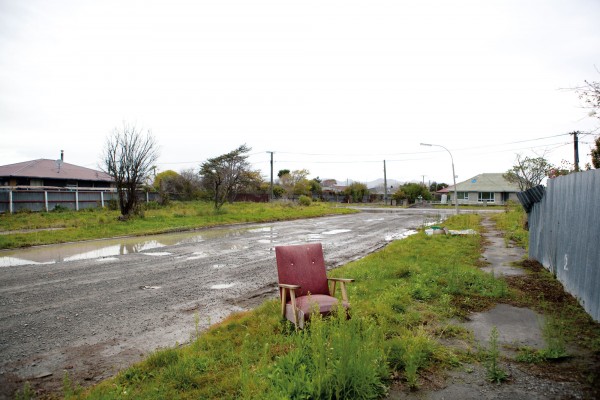 124_redzone_bodyimage Once brimming with life, tectonic forces exposed the low-lying and swampy nature of many of Christchurch’s eastern areas. When the residents moved out, nature moved in, leaving an eerie emptiness to the shattered streetscape in Bexley.