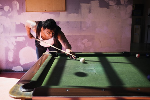 A man plays pool at Wellington’s Clubhouse drop-in centre. Such places form a core part of what is known as ‘the circuit’, the daily routine for those living in the most severe forms of homelessness. The circuit begins when the night shelter opens at 7.30am, and takes in breakfast at the soup kitchen; daytime spent at the Wellington central library, in a drop-in centre, wandering the streets or begging; dinner at the soup kitchen; evenings at the Catacombs drop-in centre; then a return to the night shelter before the door closes at 9pm. 