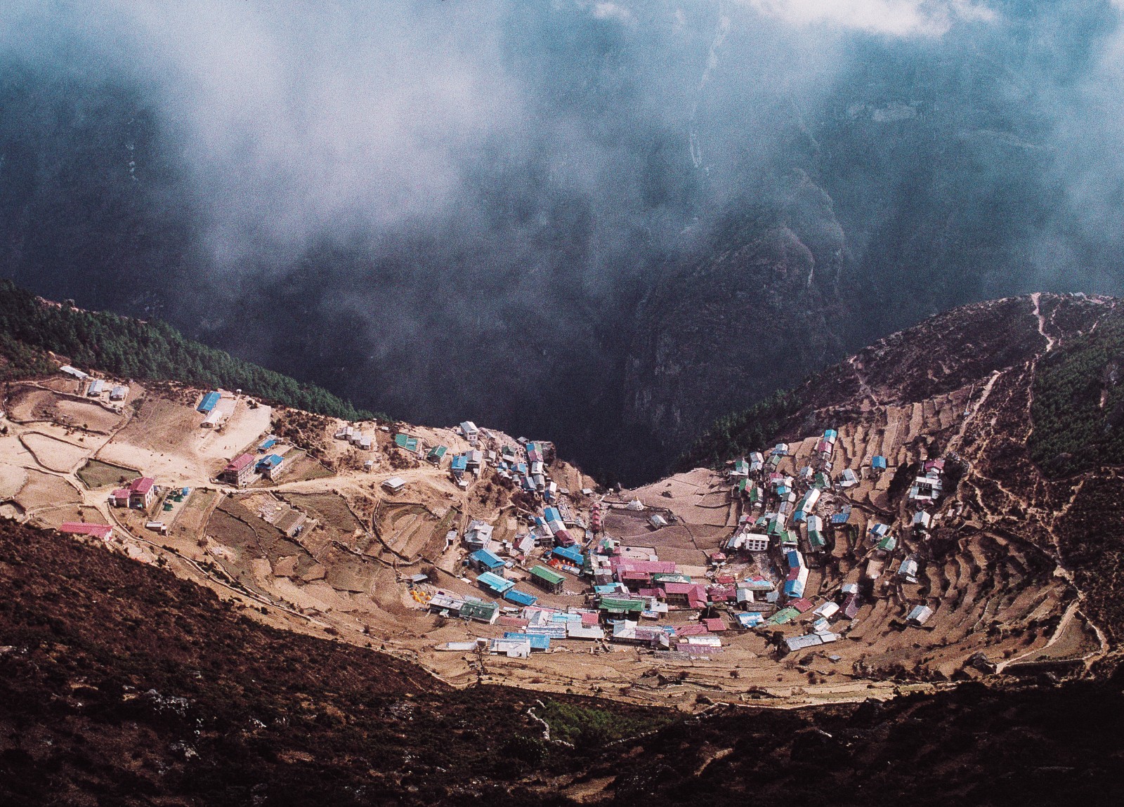 The dusty terraces of Namche Bazar are carved from the rugged terrain-there are no roads, and the nearest airstrip is a three-day walk away. In this mountainous land, said one early traveller, "every field is a victory."