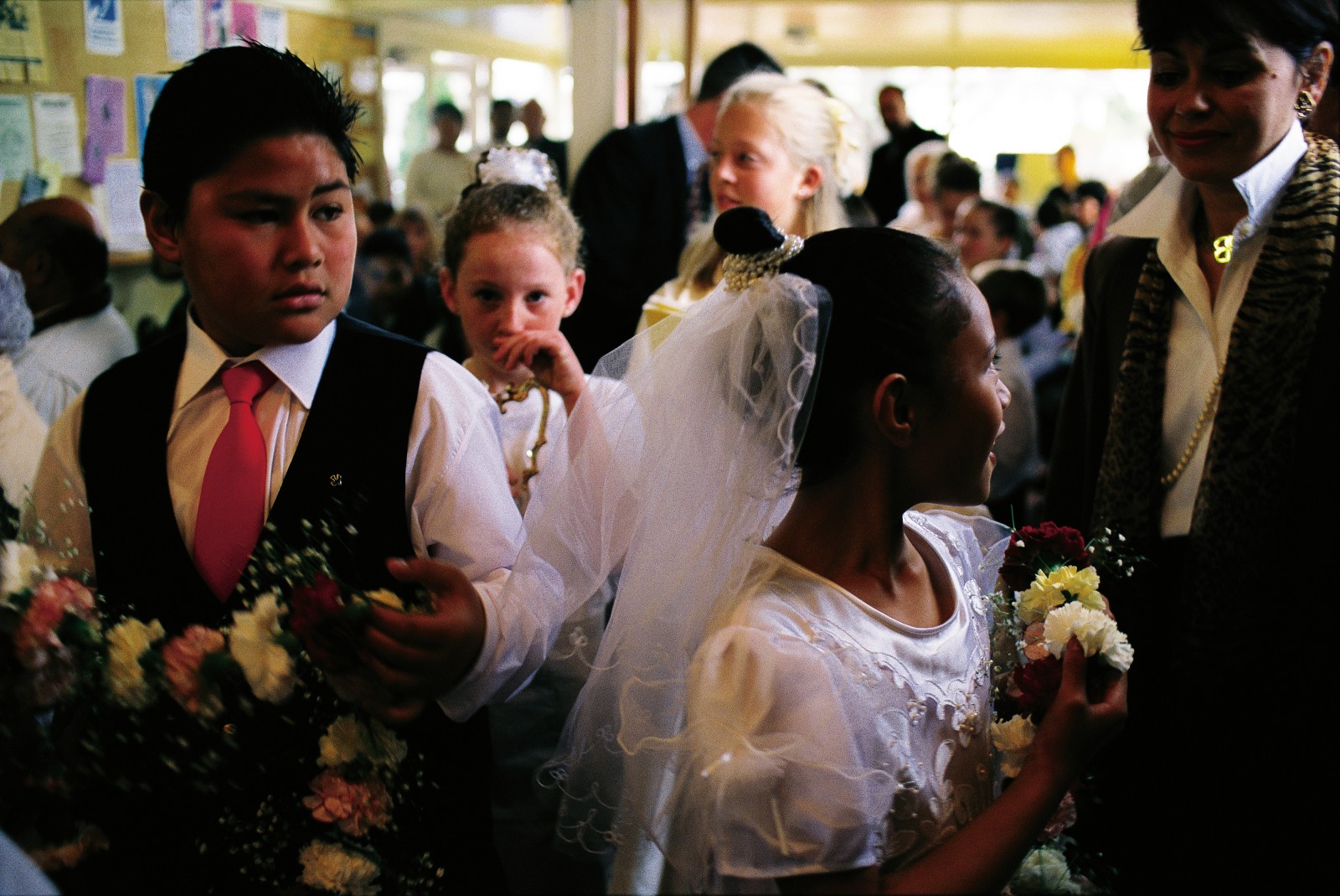 The lives of Catholic children are punctuated by a series of such ceremonies, including first communion (right), where the gorgeous dresses worn by these girls at St Mary's, Papakura, are frequently on display.