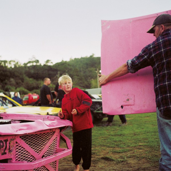 Randal Tarrant, of Hawke’s Bay, helps his dad, Beatle, fix up a Street Stock car they’ve dubbed the “Pink Pig”—a much modified Chrysler Charger. “All my cars have been pigs,” admits Beatle. “I treat them like pigs, wrecking them until they’re not worth fixing.” Beatle’s technique has earned him a place in New Zealand’s unofficial demolition-derby racing team. Although this form of racing is now banned from most speedway tracks, New Zealand held the world title for four consecutive years, until losing to the Americans in 2003 in Chicago.