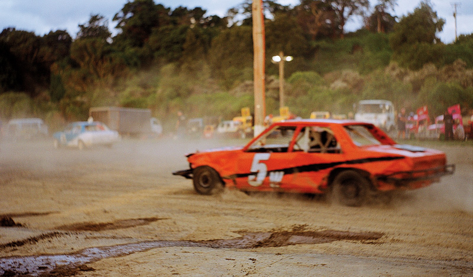 “Escort Class” is an entry-level Street Stock category designed to entice beginners to the sport. Typically, a driver will invest $3000 in this type of vehicle, but financially it’s all uphill from there. The average purchase price for a Standard Stock car is $7000, but some are worth 10 times this amount. Speedway New Zealand estimates its 2300 registered competitors have over $40 million invested in vehicles at any one time. They will spend between $1000 and $20,000 on maintenance and refitting per vehicle—a figure that doesn’t include running expenses such as fuel and tyres.