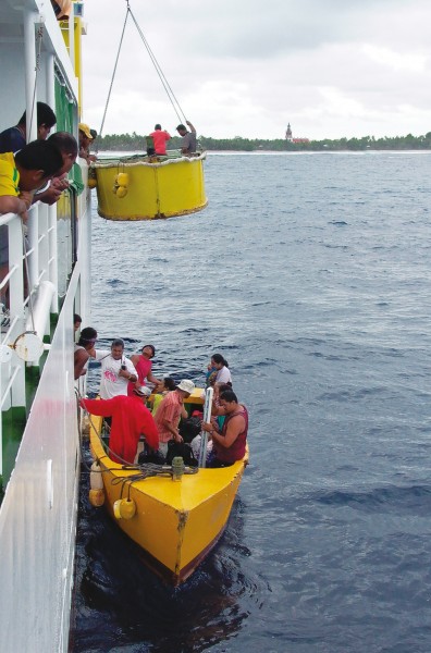 The steeple of the Ekalesia Kelisiano Tuvalu church dominates the skyline of Nanumea, Tuvalu’s northernmost atoll. Nanumea lacks a deep-water port, so goods and visitors are landed by small boat through a passage in the reef. Supply ships visit the outer islands about twice a month.