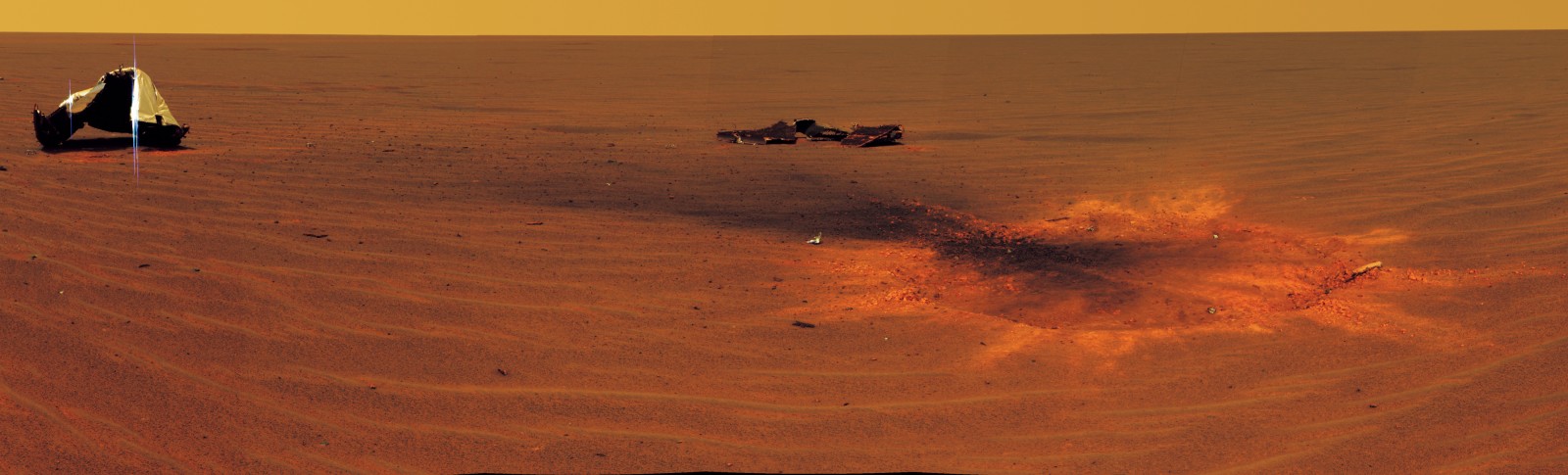 An extraterrestrials that land on Mars will be in no doubt that they have encountered signs of alien intelligence. This picture is taken by the Rover Opportunity as it circles some detritus, including a heat shielf beside an impact-crater of its own landing on Mars. Opportunity also encountered rocks formed out of sulphate salts, confirming that salt-laden seas were once a feature of this apparent wasteland.