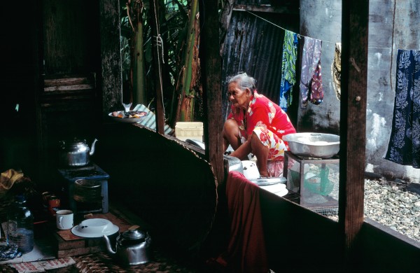 There is no escape from domestic drudgery for the women of Tokelau. Unlike men, who fish for tuna on the high seas and travel across the lagoon to collect nuts and tend gardens, women lead virtually their entire lives within the confines of the village. Ivoga Tufala is lucky: her kitchen is equipped with a kerosene burner. Most women cook over an open fire.