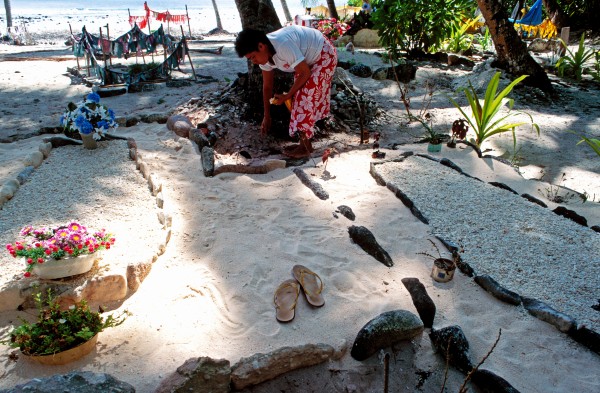 Although each atoll has a hospital , specialist treatment is days away. This and the erratic availability of drugs mean that even routine illnesses can be fatal. In the cemetery at Atafu, Ave Foua tends the grave of her daughter, who died this year from a curable complication during pregnancy.