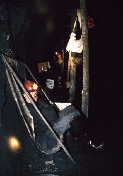 Deep in the Sullivan mine near Denniston, Ollie takes his smoko or "crib" in a make-shift sling. Most miners spend their entire 7 - 12-hour shifts below ground, because the surface is too far off.