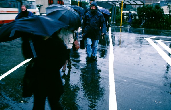 35_Cook_Strait_08 Morning commuters battle a Wellington gale on their way to work. Unwary pedestrians are regularly bowled by strong gusts at street level, although much more powerful blasts tear around the hilltops.