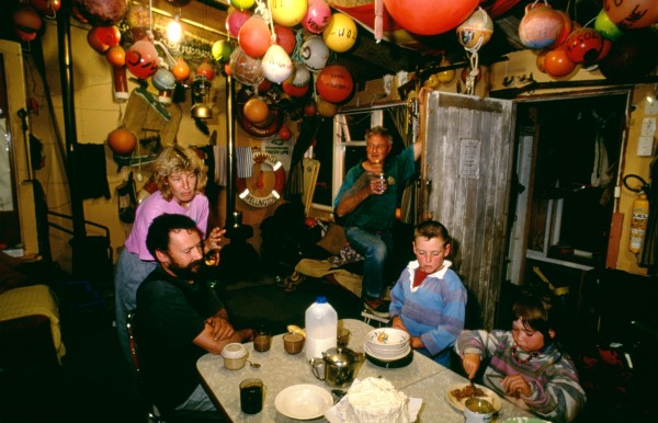 35_Cook_Strait_14 Even if you're baching it and the neighbours are over with a pav, you still have to finish your main course before starting on dessert. Ian Partington and his children Aaron and Hayley spend every weekend at their bach near the mouth of Karori Stream, where, says lan, "the fishing is great." The area is accessible only by 4WD vehicle along the beach, and they use a bulldozer and winch to launch their runabout.