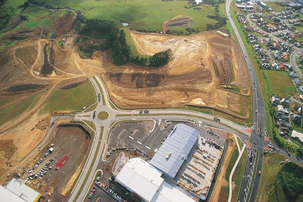 The scrapings and scrabblings of earthmovers quickly five rise to a rash of new roads, the first stage of development. Albany's new retail and business centre will cover an area greater than 50 hectares—about 10 times larger than the denuded area seen here. Over the last five years, 62 per cent of new nonresidential building on Auckland's North Shore has been in Albany. In the year to September 1997, building permits for 124,000 square metres of commercial premises were issued for this area.