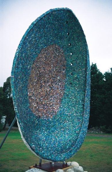 Few shells can equal the rich iridescence of the interior of the paua, a beauty that the town of Riverton, in Southland, has attempted to take to itself, first with a three-metre-high concrete and lately with an even more arresting four-metre specimen.