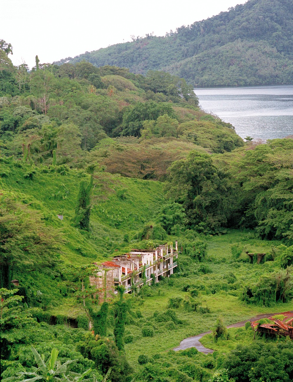 At Kieta, life has gone full circle. In the early 1970s, this quiet backwater, along with neighbouring Arawa, became a bustling service centre for the Panguna mine. Now the jungle is reclaiming the area and its monuments to waitman's privilege. In 1989, when 300 villagers displaced by the war were to be temporarily house in the Arawa Country Club, members wrote to the Prime Minister of PNG expressing their outrage. They were assure that the refugees would be kept from the gold course and tennis courts.