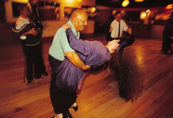 Ballroom, Latin, rock’n’roll—all styles are served at the Albert School of Dancing. Located above a tyre service centre in Papatoetoe, the studio also appeals across the ethnic spectrum, with Europeans, Maori, Polynesians and Asians all keen to trip the light fantastic. “Many people have met their future spouses at our classes,” says Albert Snelgar (background, right), here teaching the lambada. “Others have made lasting friendships.”