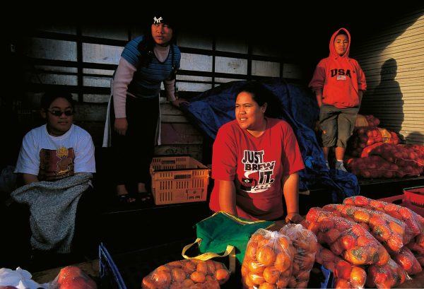 Captured on a wintry Saturday afternoon in 2002, these Wiri fruit vendors were ever hopeful of a car pulling over for a bag of persimmons or mandarins. Nerissa Semisi (left), Ollie Taulua, Alice Autufuga and Nephi Leatigaga have since lost their lay-by possie to a road-widening scheme.