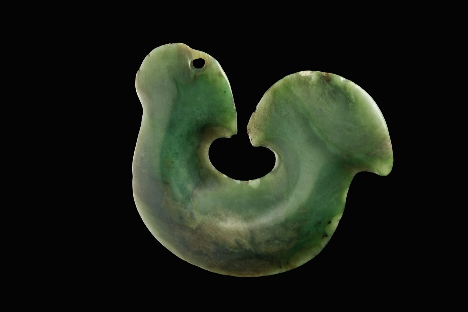 The wearing of stylised hei matau is today seen as a symbol of Maori cultural revival. Large, flat taonga which superficially resemble much smaller fishhooks were thought to be stylised fishhooks by early historians. However, they may in fact represent tools (possibly scrapers), which were replaced by metal tools shortly after the arrival of Europeans and retained as decorative items when the knowledge of their original function had been lost. (103 mm width)