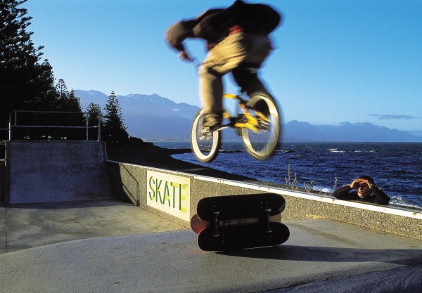 Surfing has always been a popular pursuit for Kaikoura’s young people (bottom), but before the tourism bonanza the prospect of local employment for the town's youth was bleak. Now there is fresh hope, especially for Maori, who are using the profits generated by their whale-watching venture to boost education and create jobs. A skateboard half-pipe with a million-dollar view (top) was a project of the Kaikoura Youth Council.