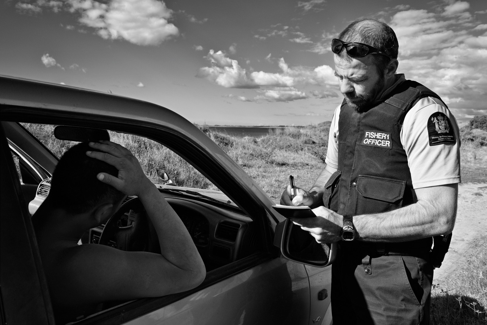 On a narrow track behind the beach, officers apprehend a family of fishers carrying excess and undersize paua. After the catch has been measured and documented, Tyrone Hansford hands one of the offenders a notice of inspection under the Search and Surveillance Act, and reminds the group of the recreational catch rules. The fishers claim to have a customary permit— which would free them from the usual size and quota limits. However, failing to produce it, they cop a $750 fine and the paua are returned to the sea.