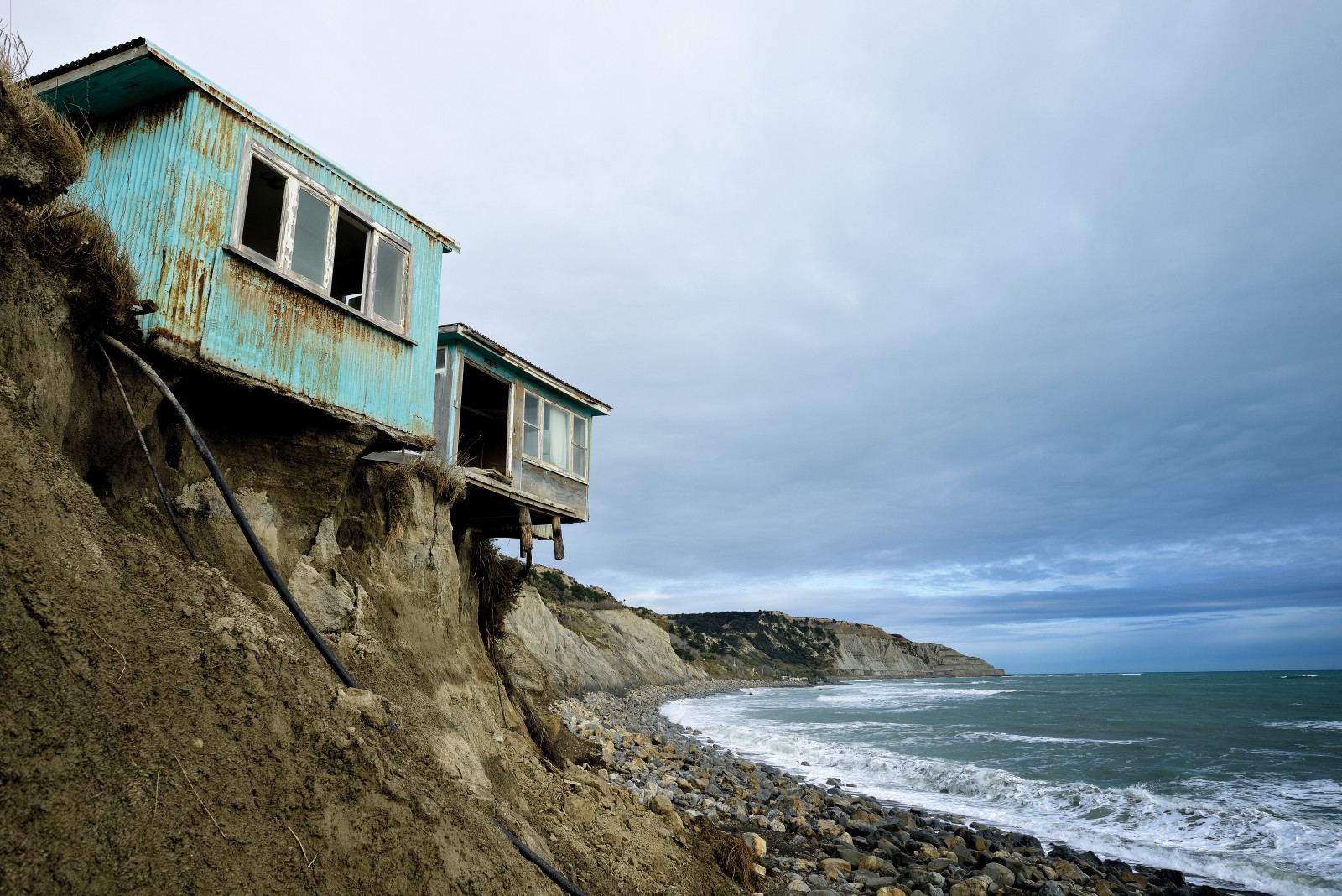 Baches teeter on the cliff edge near Cape Palliser, on the geologically unstable Wairarapa south coast, which, like other high-energy coastlines around the country, is retreating by up to a metre a year. As well as elevating sea levels, climate change is expected to bring stronger winds and heavier rain to many regions—a recipe for more severe erosion. Beachside residents often expect councils to protect their shores, but in a country with a 17,000-kilometre coastline, the cost of keeping the sea at bay will become prohibitive.
