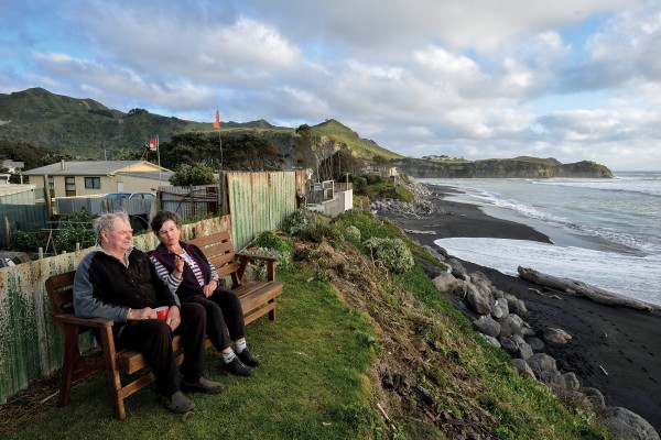 Fifty years ago, there were houses and a road in front of Bev and Ray Christiansen’s place at Mokau, on the Taranaki coast. The sea has clawed back that land, and high seas now wash up to the Christiansens’ fence. Residents banded together to protect the dune edge with boulders, but the council has forbidden any further protection work. “We’re probably sitting on a time bomb,” says Bev.