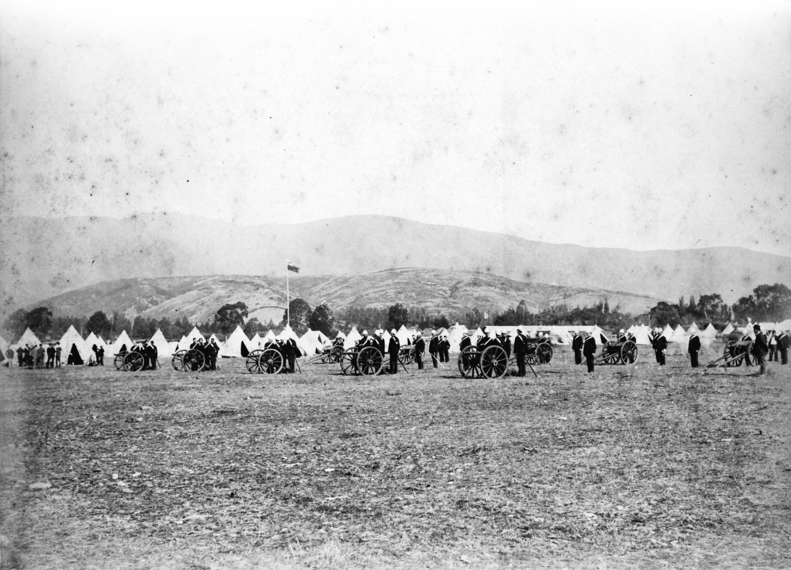 Nine years of war in Taranaki left a legacy of enduring tension between Māori and Pākehā. Because of its size and influence, Parihaka became a focal point for settler antipathy, and Native Minister John Bryce became determined to destroy “that headquarters of fanaticism and disaffection”. Obtaining volunteers for the planned invasion posed no difficulty. Settlers from around the country eagerly offered their services at the prospect of a “war with the natives”. In camp, they learned how to operate Armstrong six-pound field guns. Eventually, close to 1000 volunteers and 500 members of the Armed Constabulary marched on Parihaka on November 5, 1881.